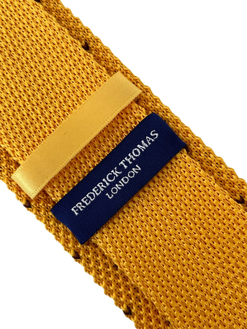 yellow gold knitted tie with brown pin spots heart design